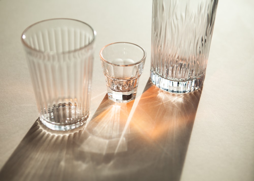 clear drinking glass on brown wooden table