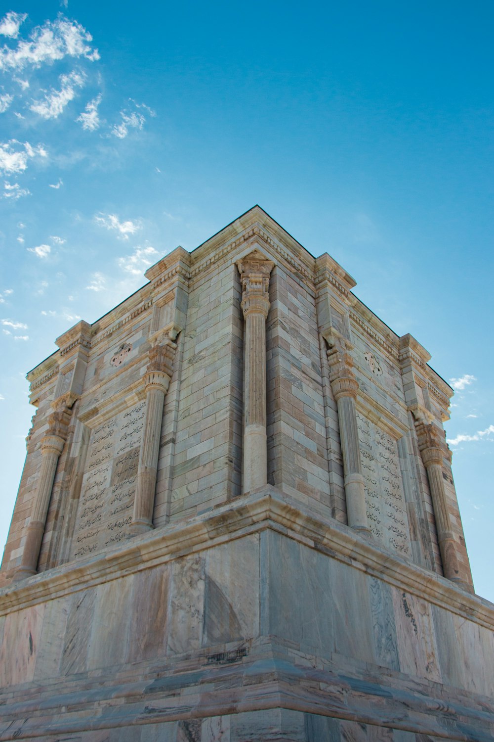 brown concrete building under blue sky during daytime