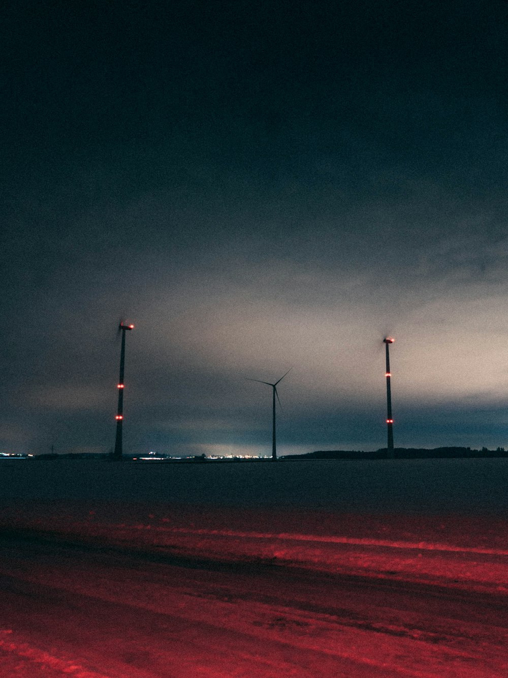 silhouette of light post under dark sky