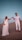 man and woman holding hands while walking on beach during daytime