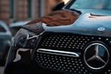 black mercedes benz car in close up photography