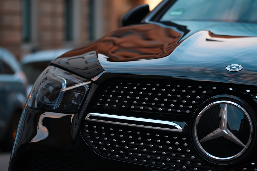 black mercedes benz car in close up photography