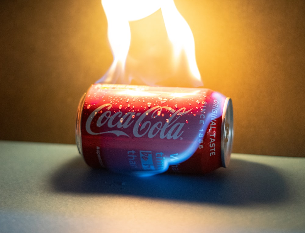 coca cola can on white table