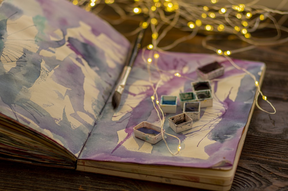 white and purple iphone case on brown wooden table