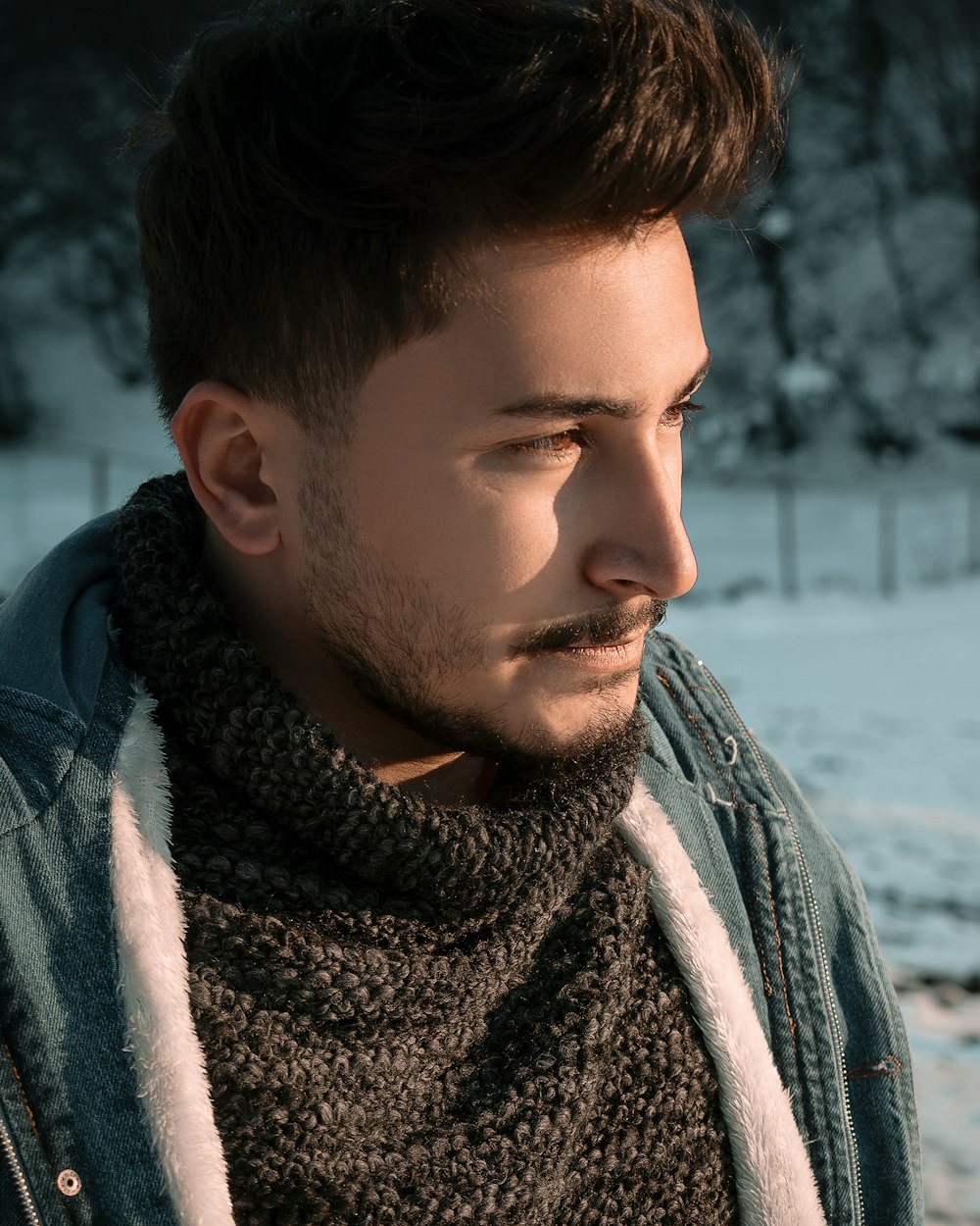 man in gray and white scarf