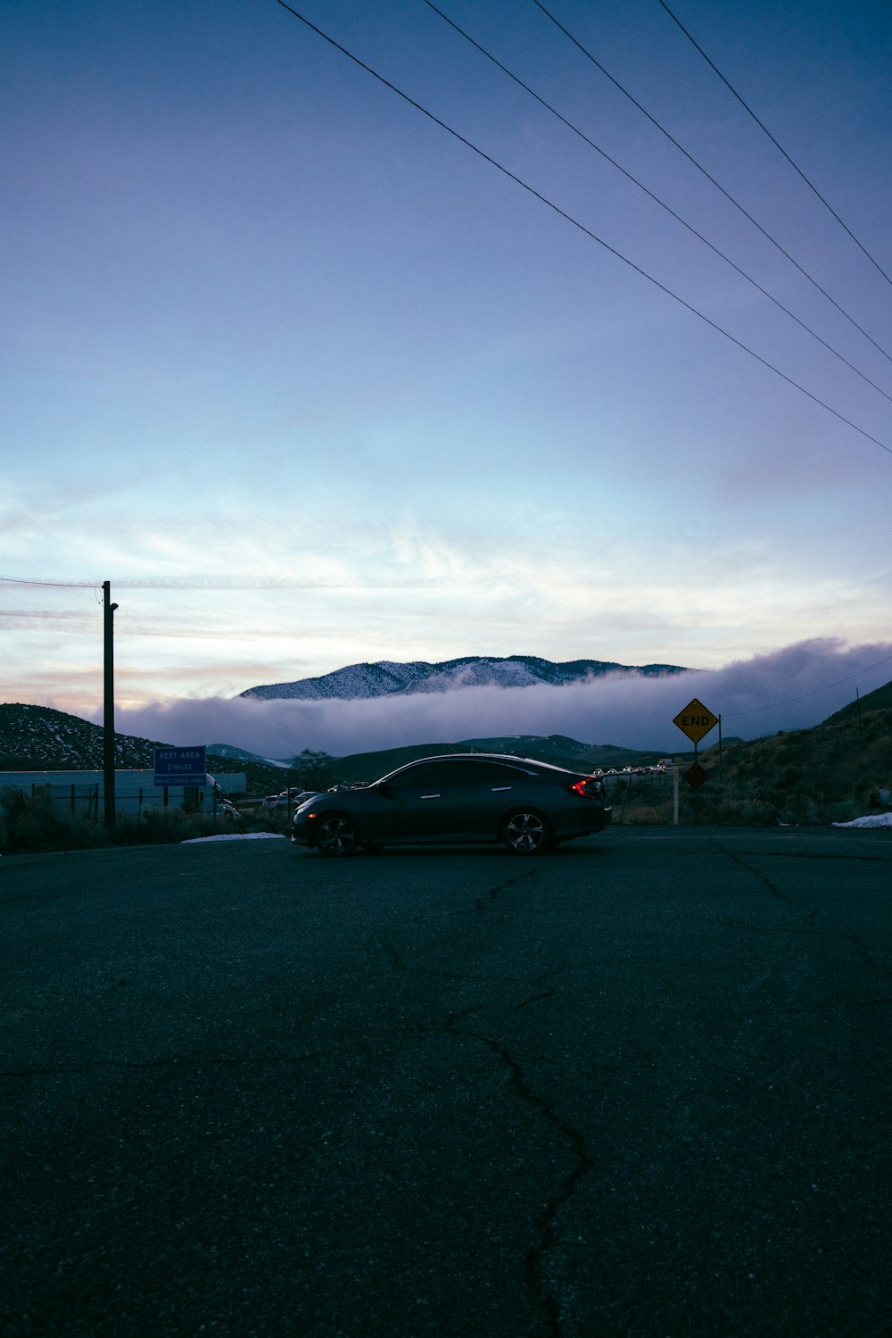 black sedan on road during daytime