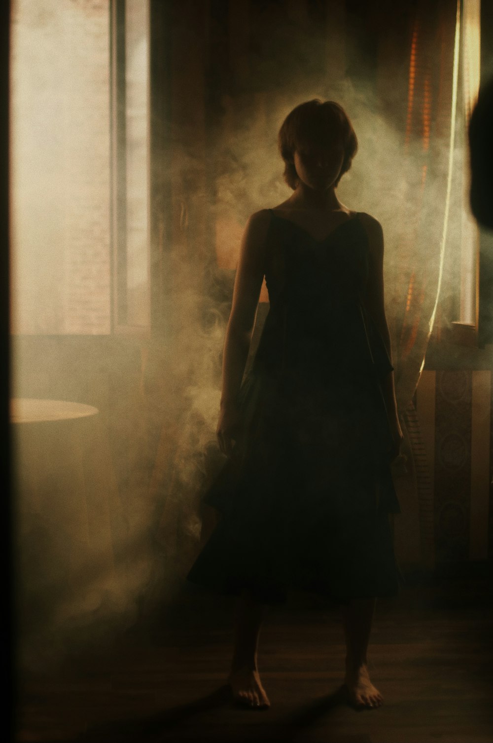 woman in black dress standing on the hallway