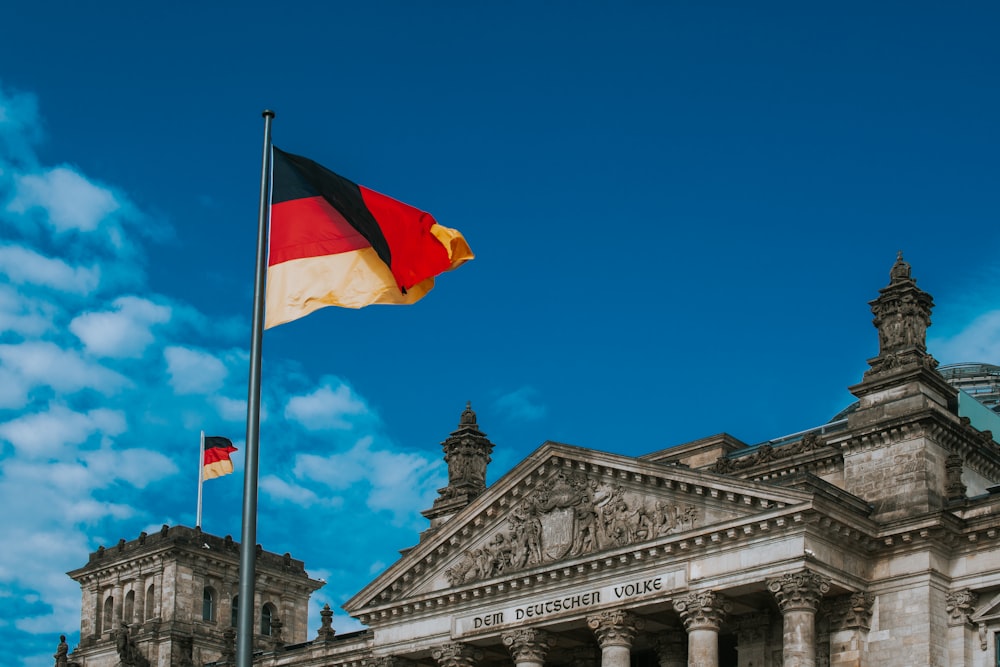 white red and yellow flag on pole