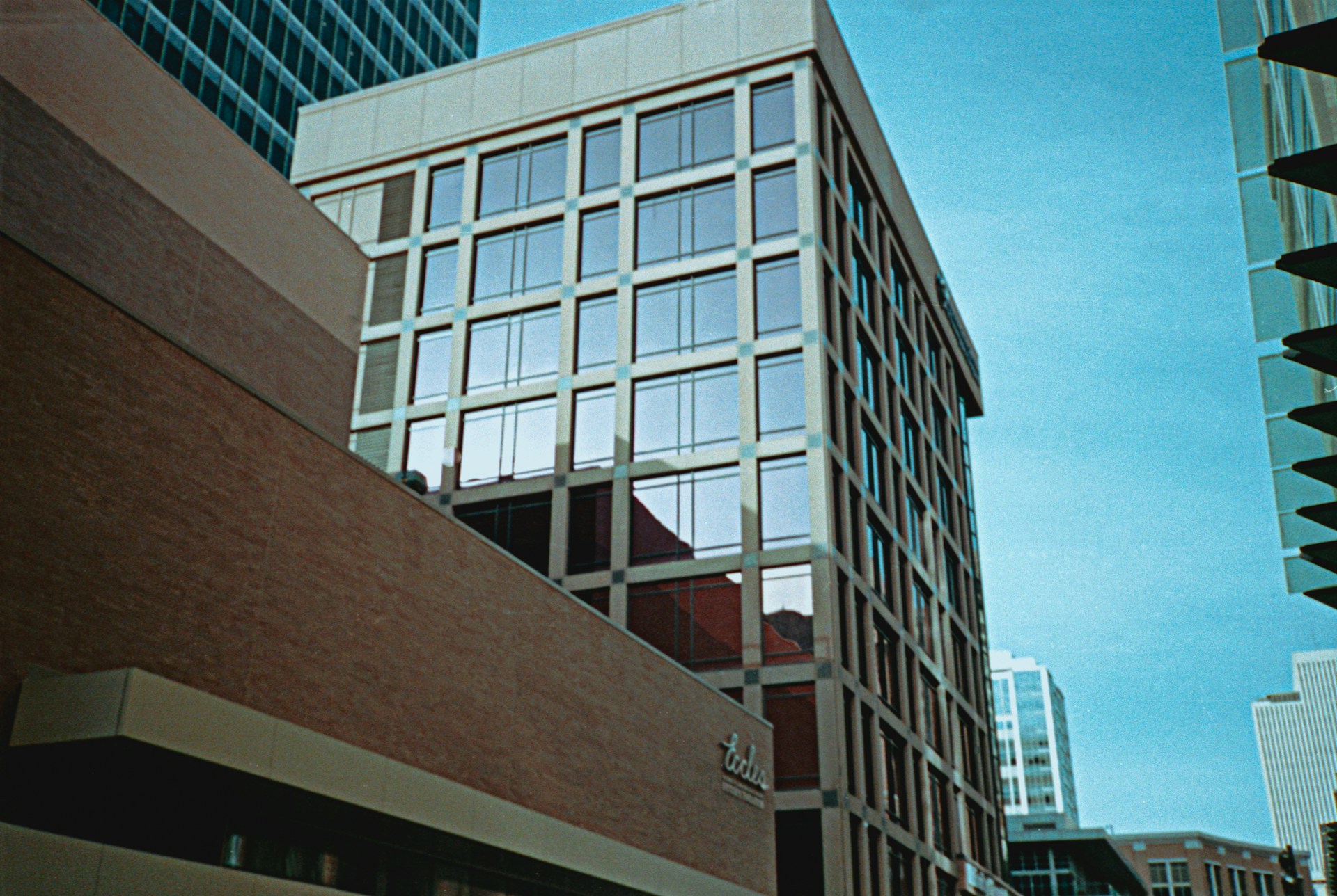 black and brown leather padded tub sofa
