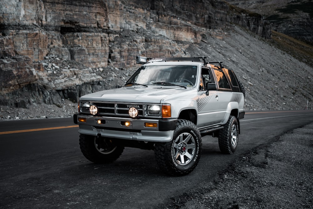 white jeep wrangler on black asphalt road photo – Free Grey Image on  Unsplash