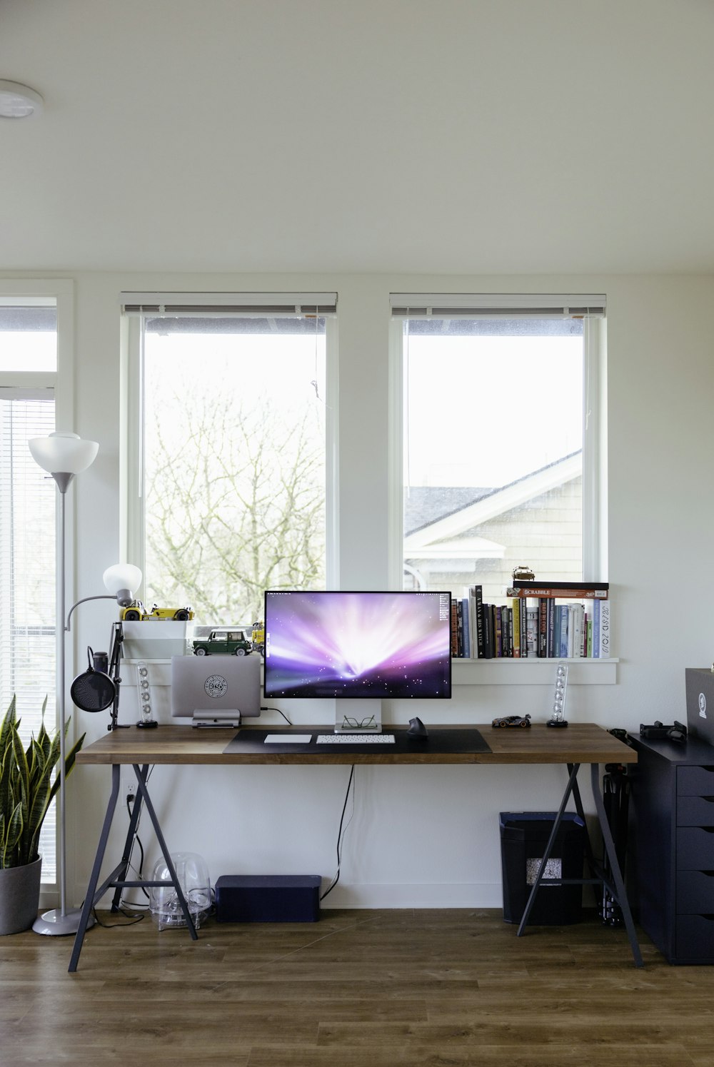 black flat screen tv on brown wooden table