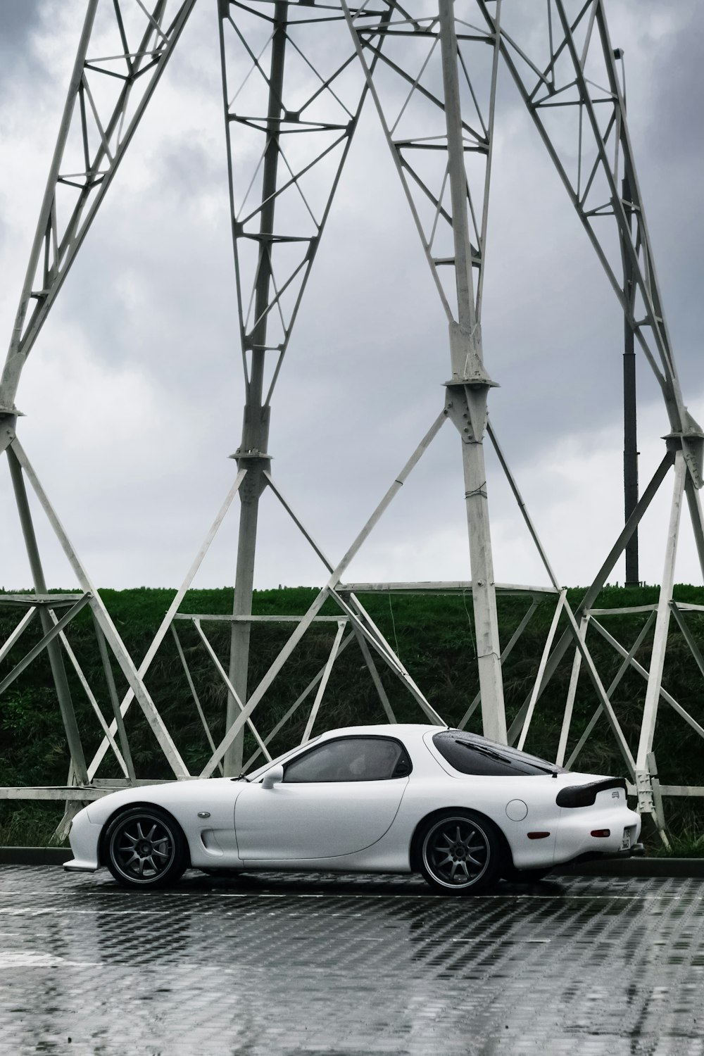 white porsche 911 parked on green grass field