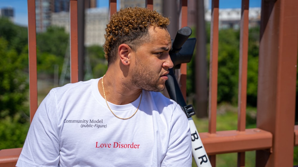 man in white crew neck t-shirt wearing black sunglasses