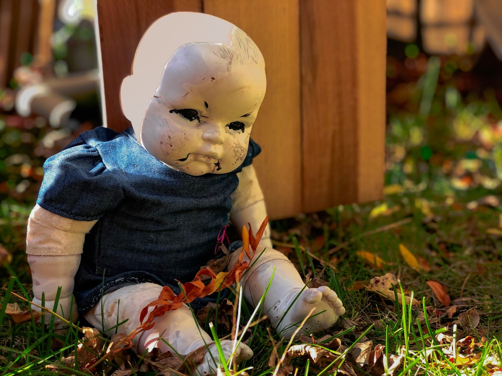 boy in blue and brown sweater figurine