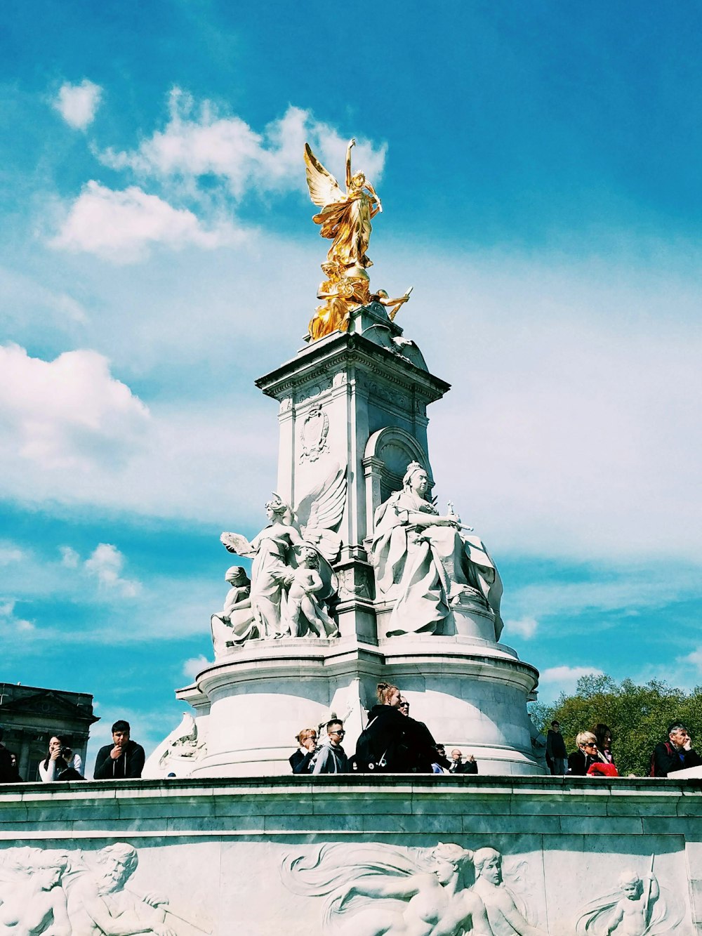 gold statue of man riding horse