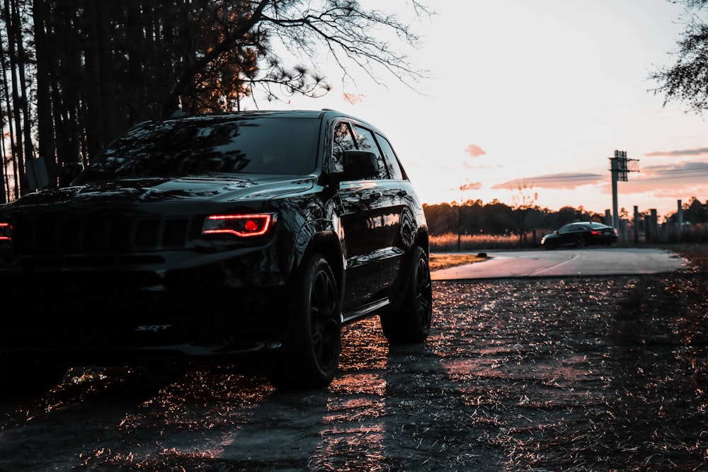 black suv on gray sand during daytime