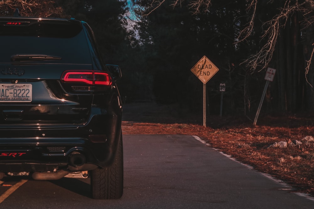 black car on road during daytime