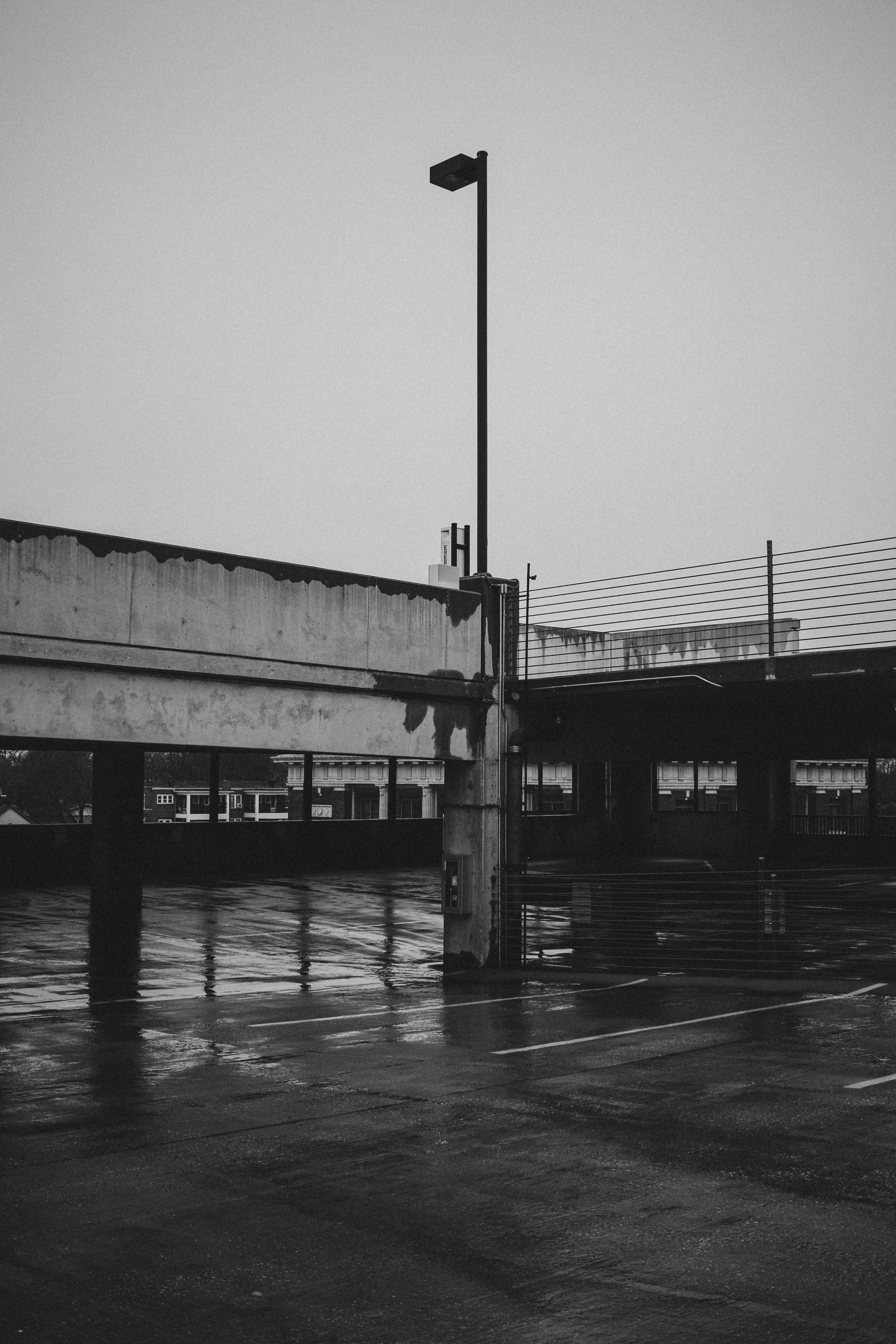 grayscale photo of bridge over water