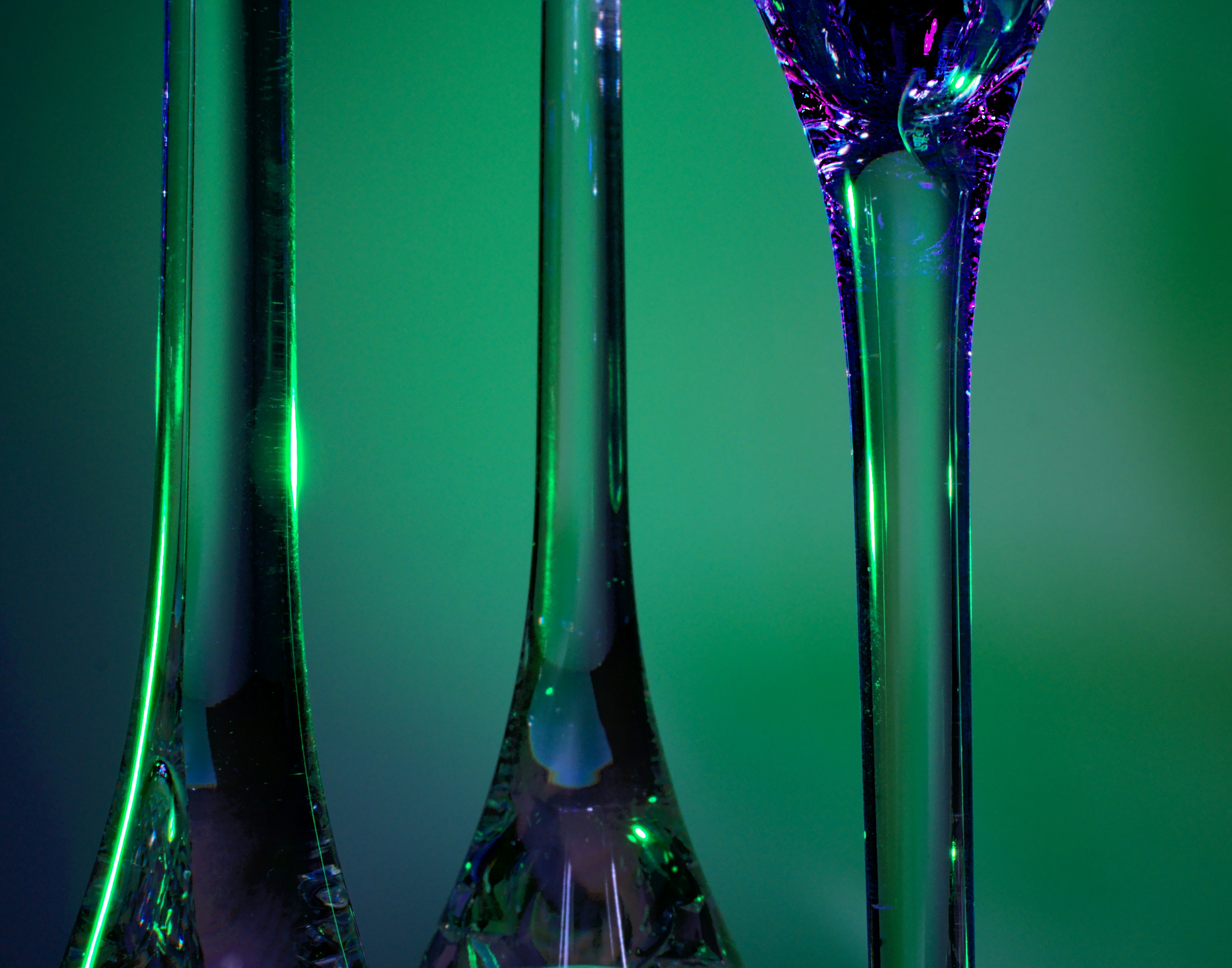 green glass bottle on table