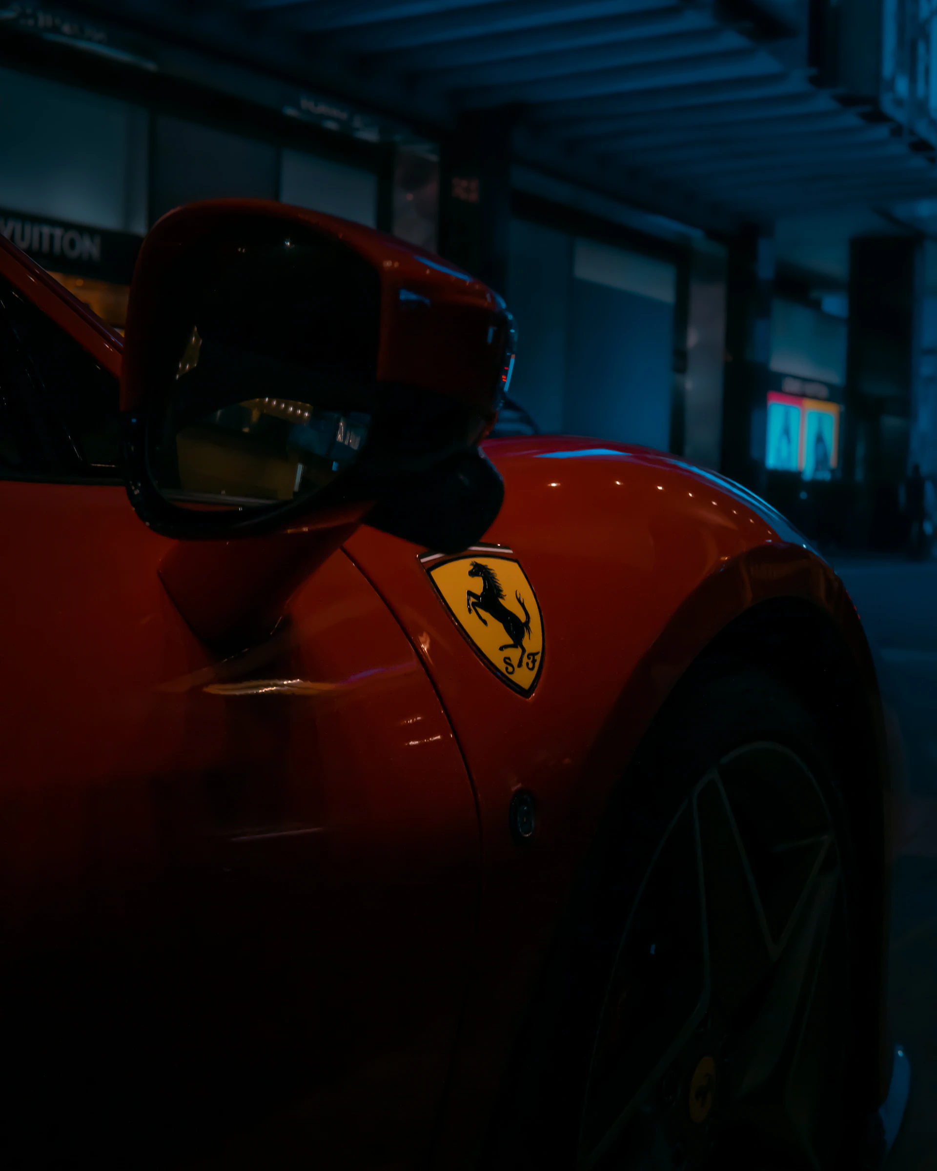 A glossy red Ferrari F8 Spider captured at dusk, the blurred Miami skyline glowing behind it to emphasize its exotic allure.