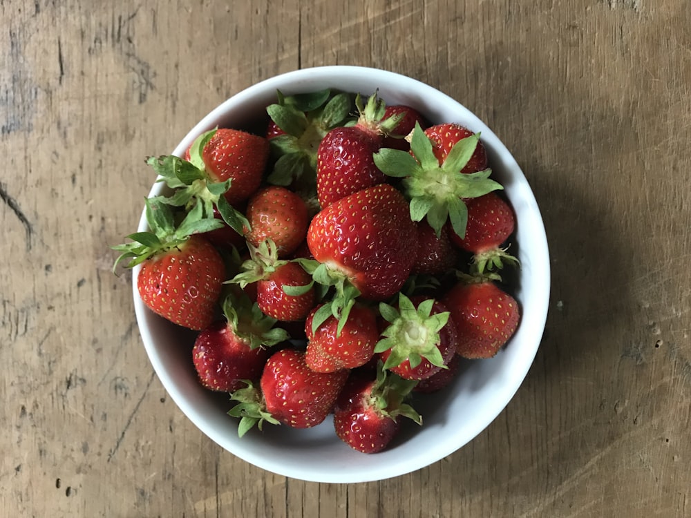 strawberries in white ceramic bowl