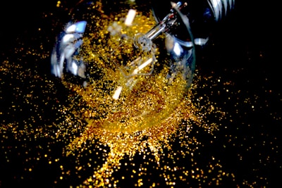 A vibrant digital illustration of a lightbulb surrounded by colorful sparks representing creative ideas.