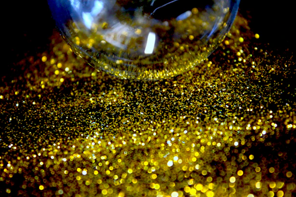 Close-up of a glittery floral epoxy tumbler catching sunlight