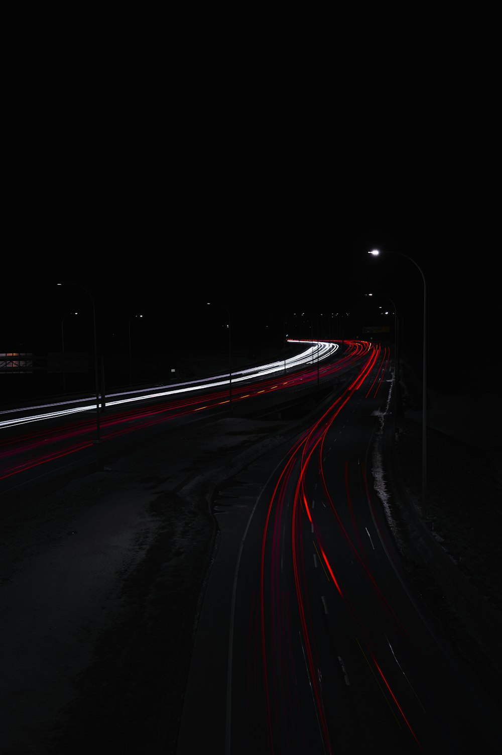 time lapse photography of cars on road during night time