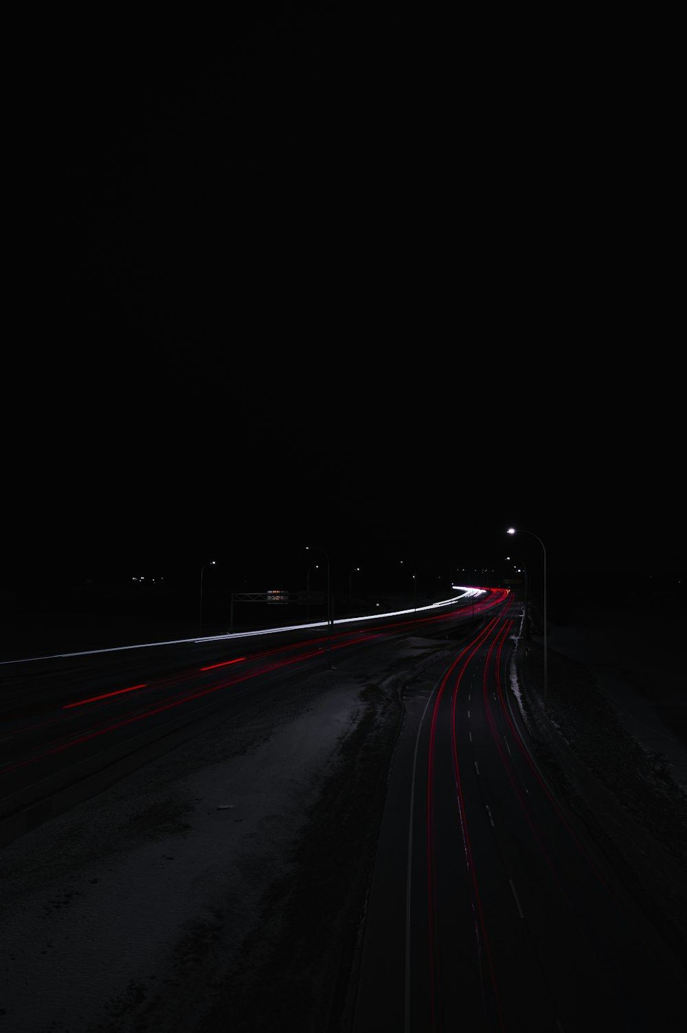 black and red road during night time