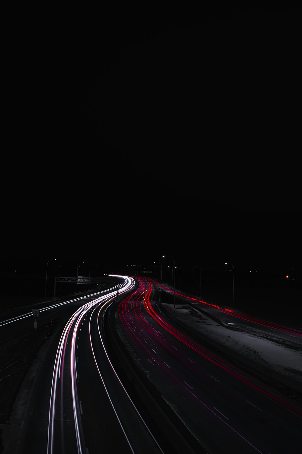 time lapse photography of cars on road during night time