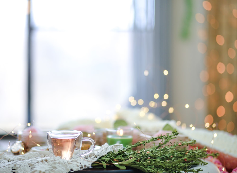 clear glass cup on table