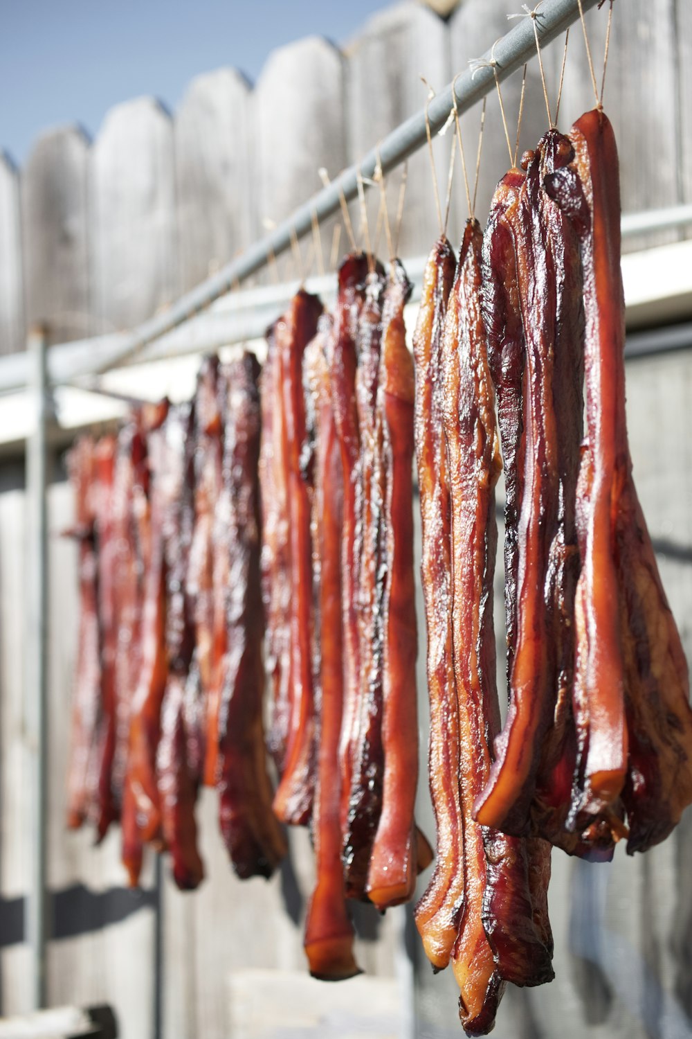 raw meat on gray metal rack