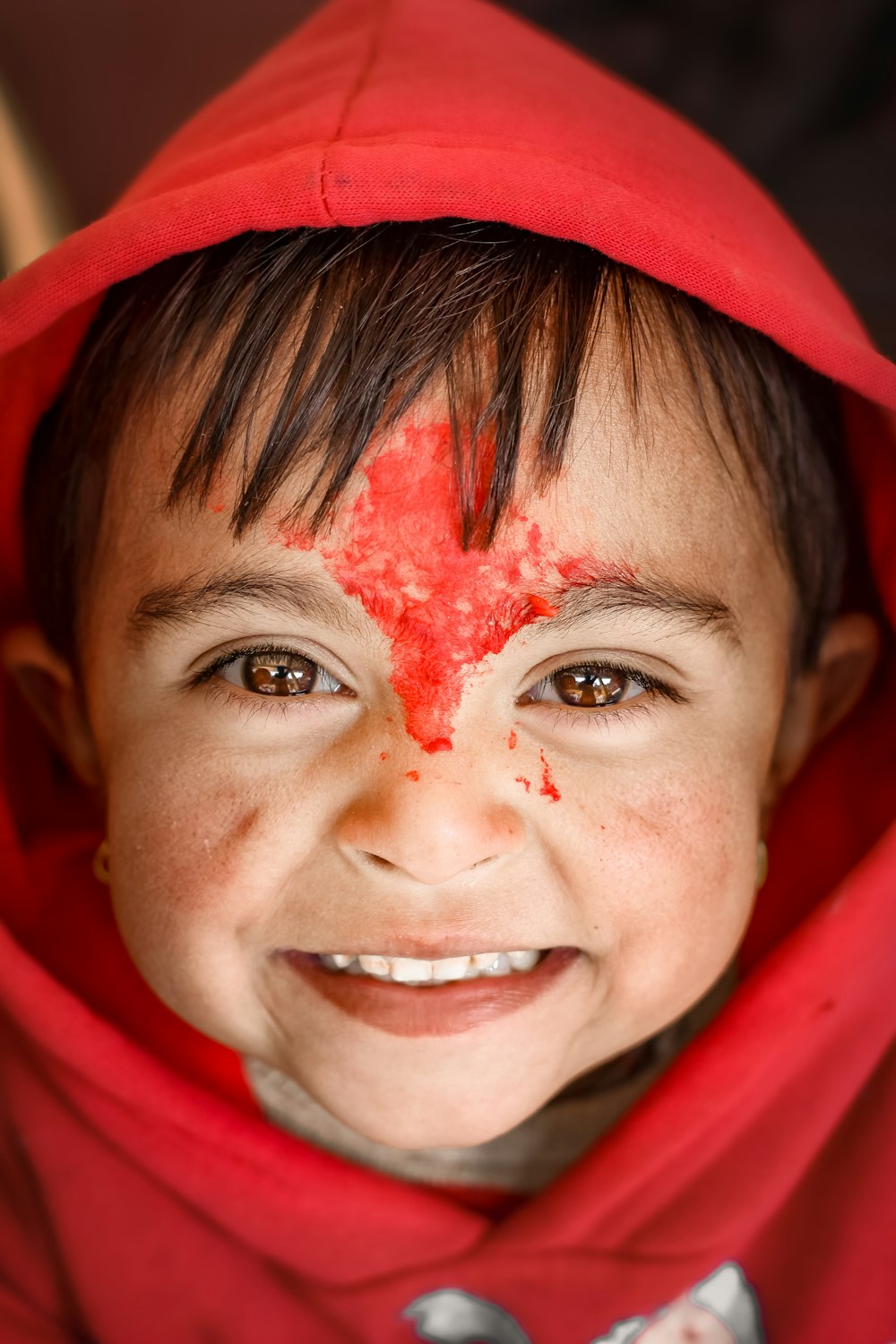 woman in red hijab with white powder on her face