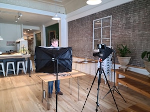 man in gray shirt sitting on black chair
