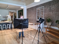 man in gray shirt sitting on black chair