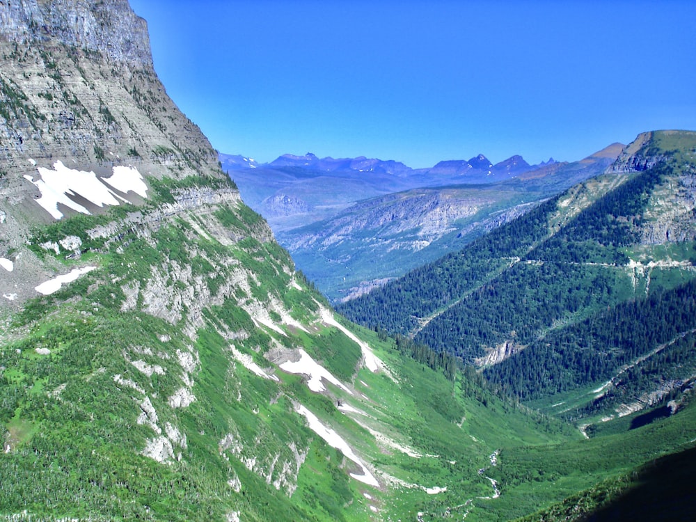 green and white mountains under blue sky during daytime