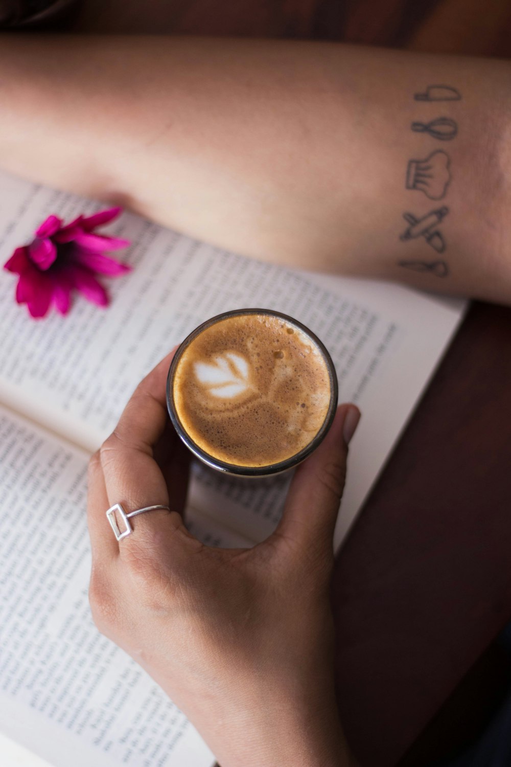 person holding black ceramic mug with coffee