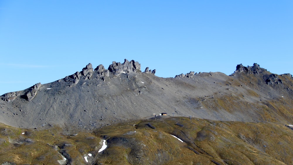 gray and green mountain under blue sky during daytime