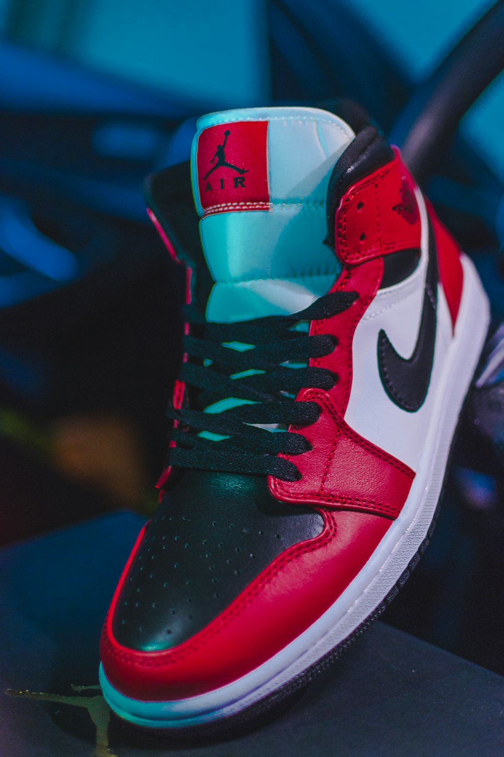 red and black nike basketball shoe photo – Free Image on Unsplash
