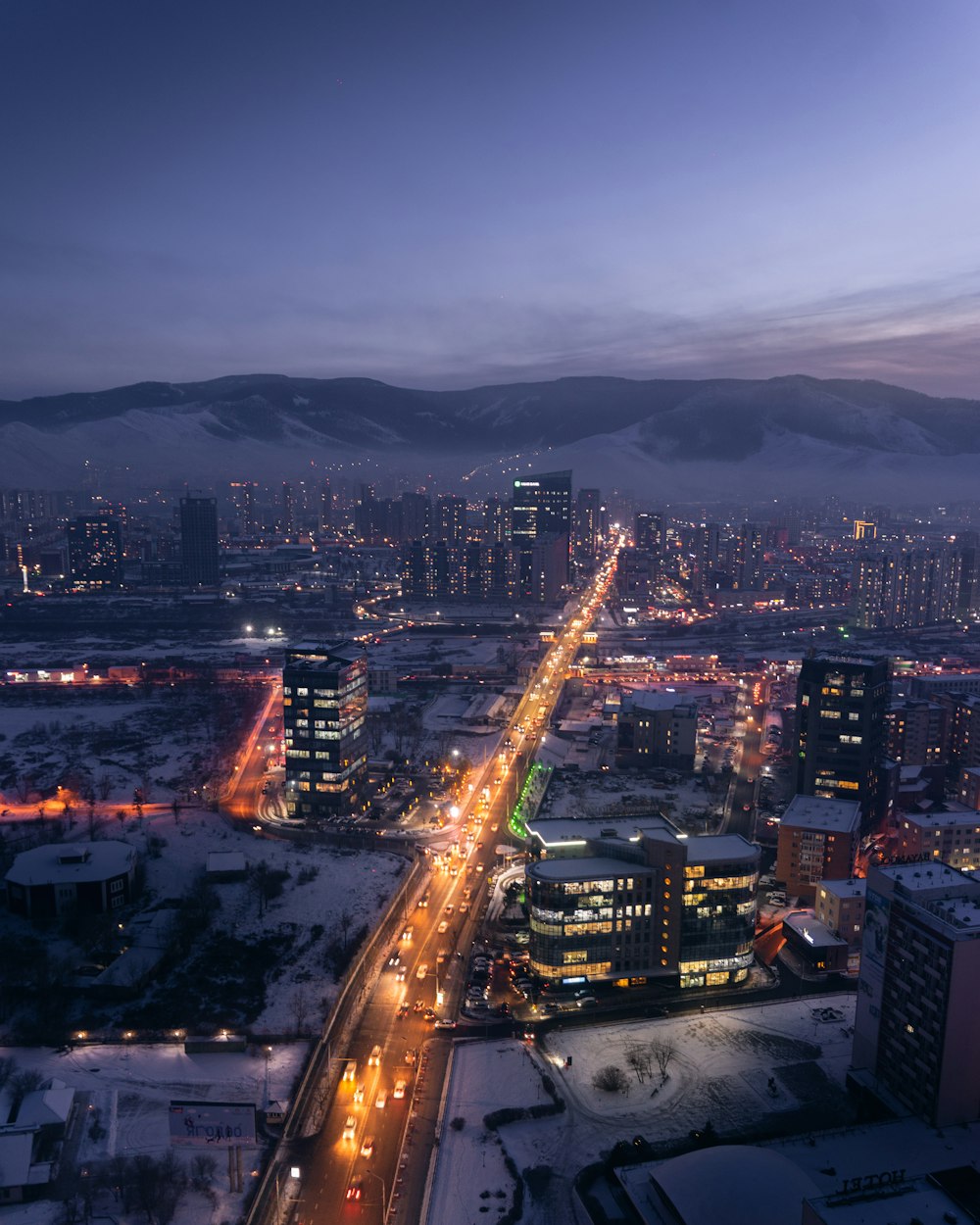 city with high rise buildings during night time