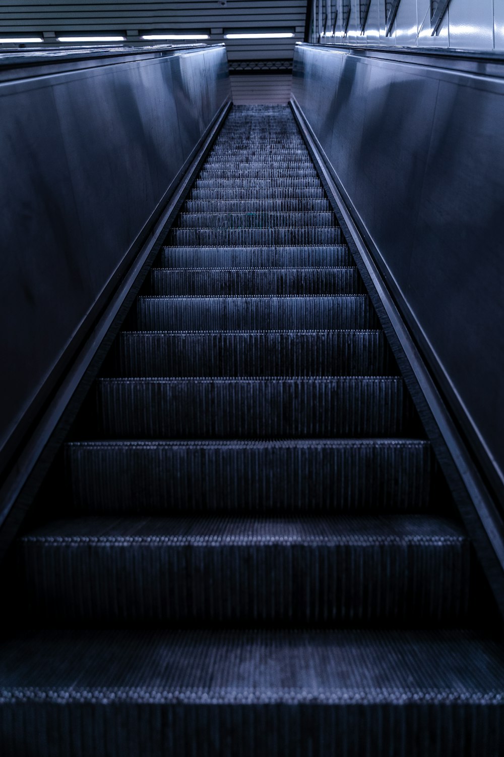 black and gray staircase with black metal railings