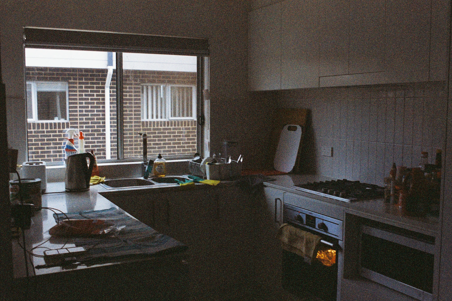 Before: Dated dark kitchen with old cabinets before renovation