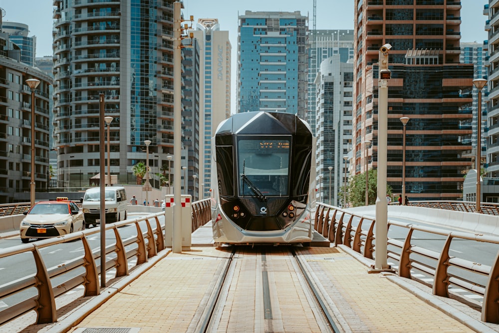 gray and black train on rail during daytime