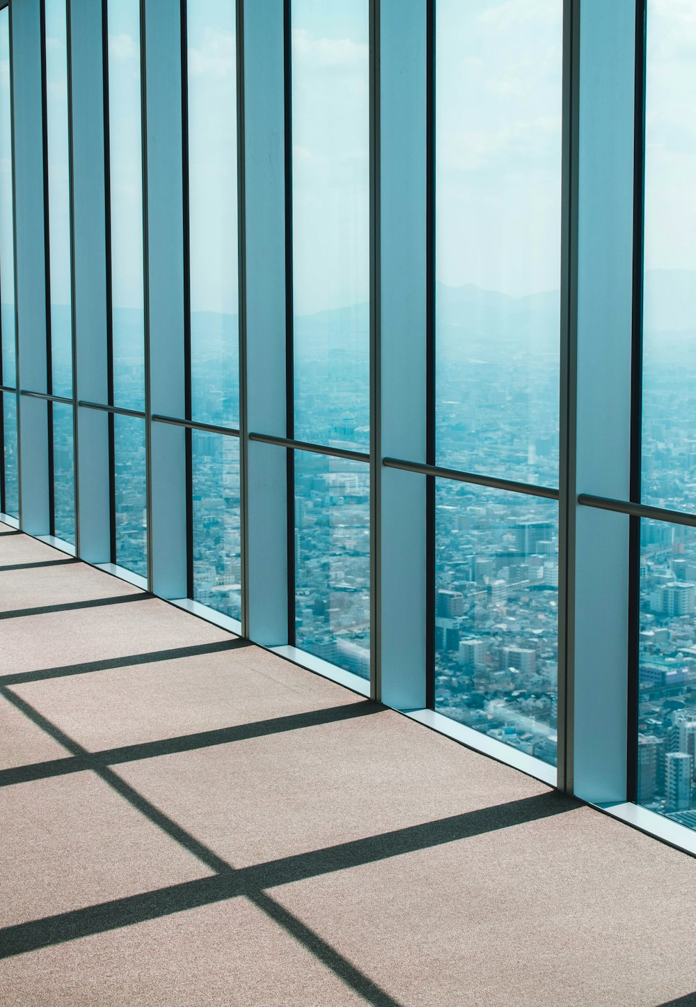 blue glass window during daytime