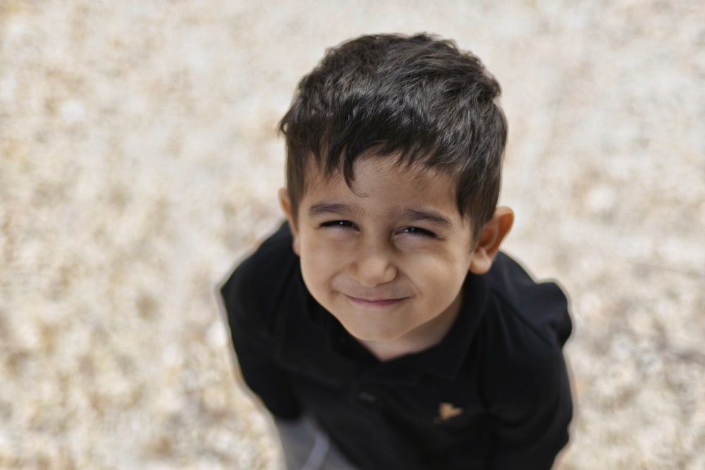 boy in black and white jacket