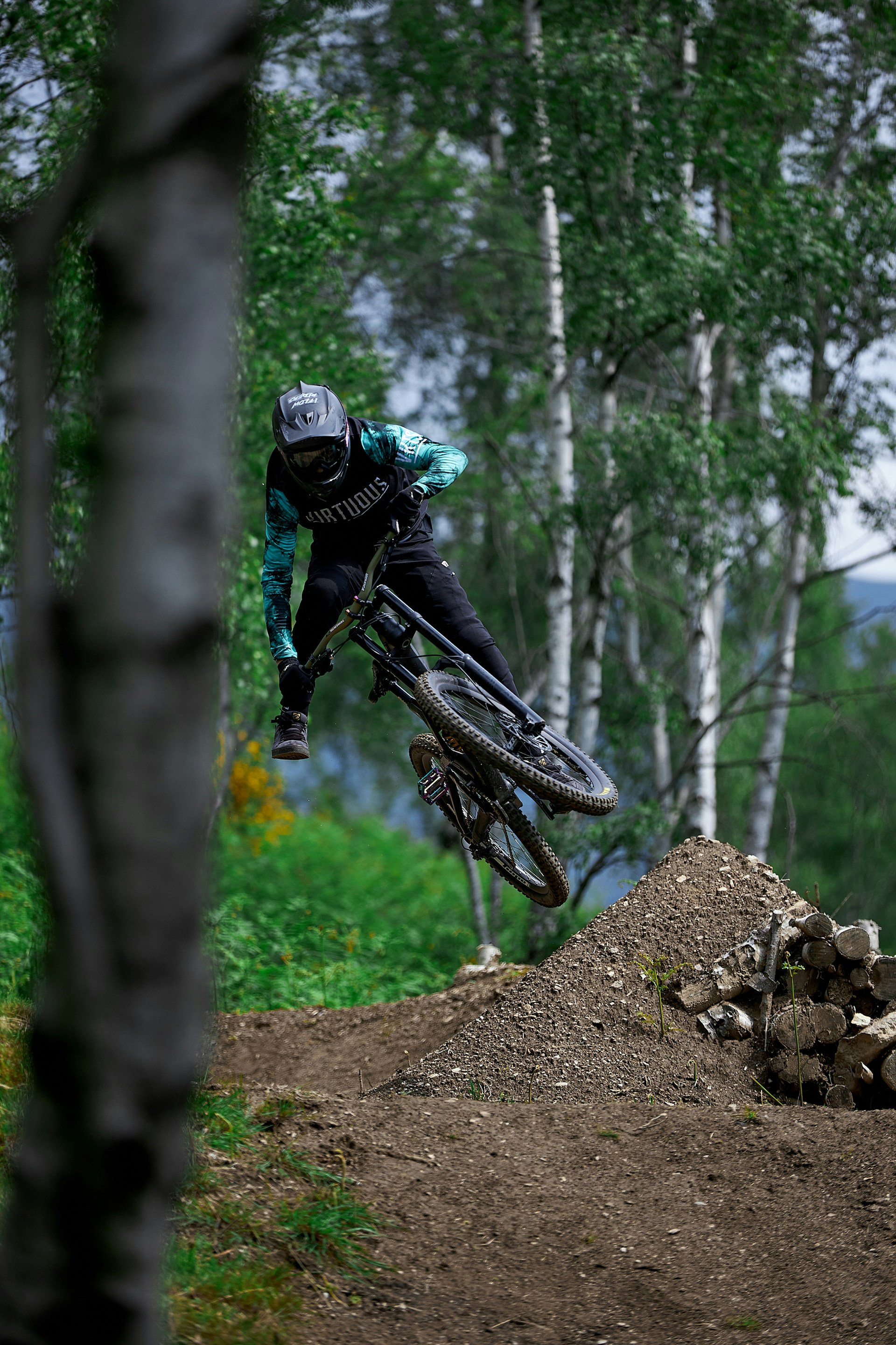 man in black jacket riding on motocross dirt bike