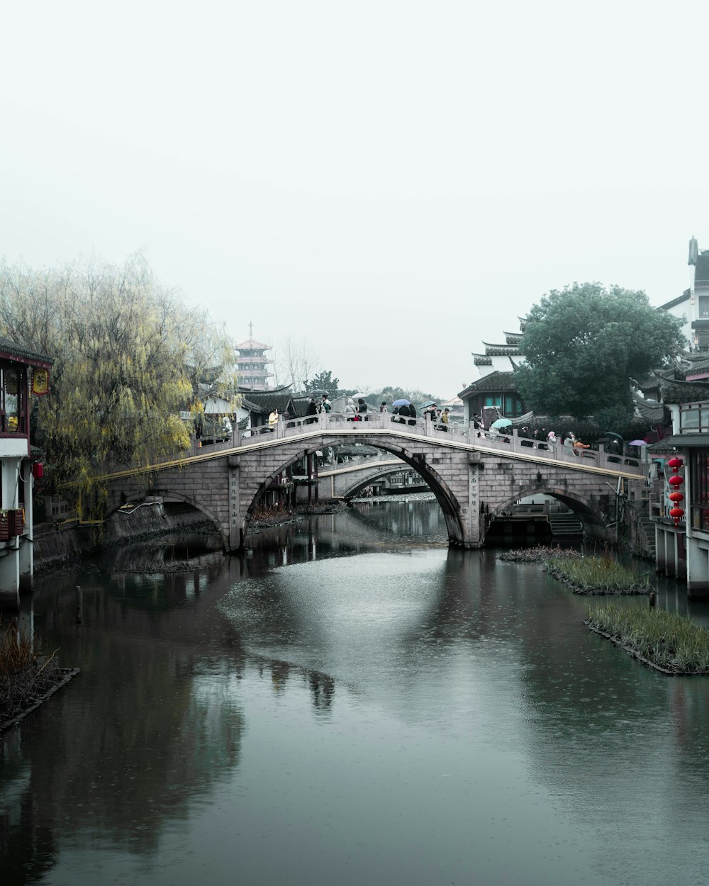 gray bridge over river during daytime