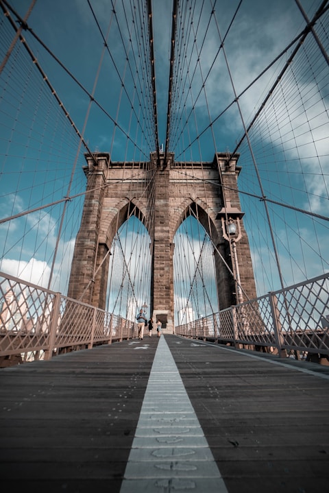 Brooklyn New York bridge under blue sky during daytime