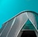 An architectural structure featuring a modern, curved design with a pattern of diagonal lines and large glass elements in the facade against a teal sky.
