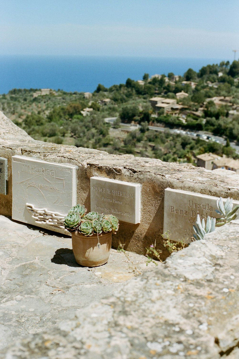 gray concrete tomb on gray rock during daytime